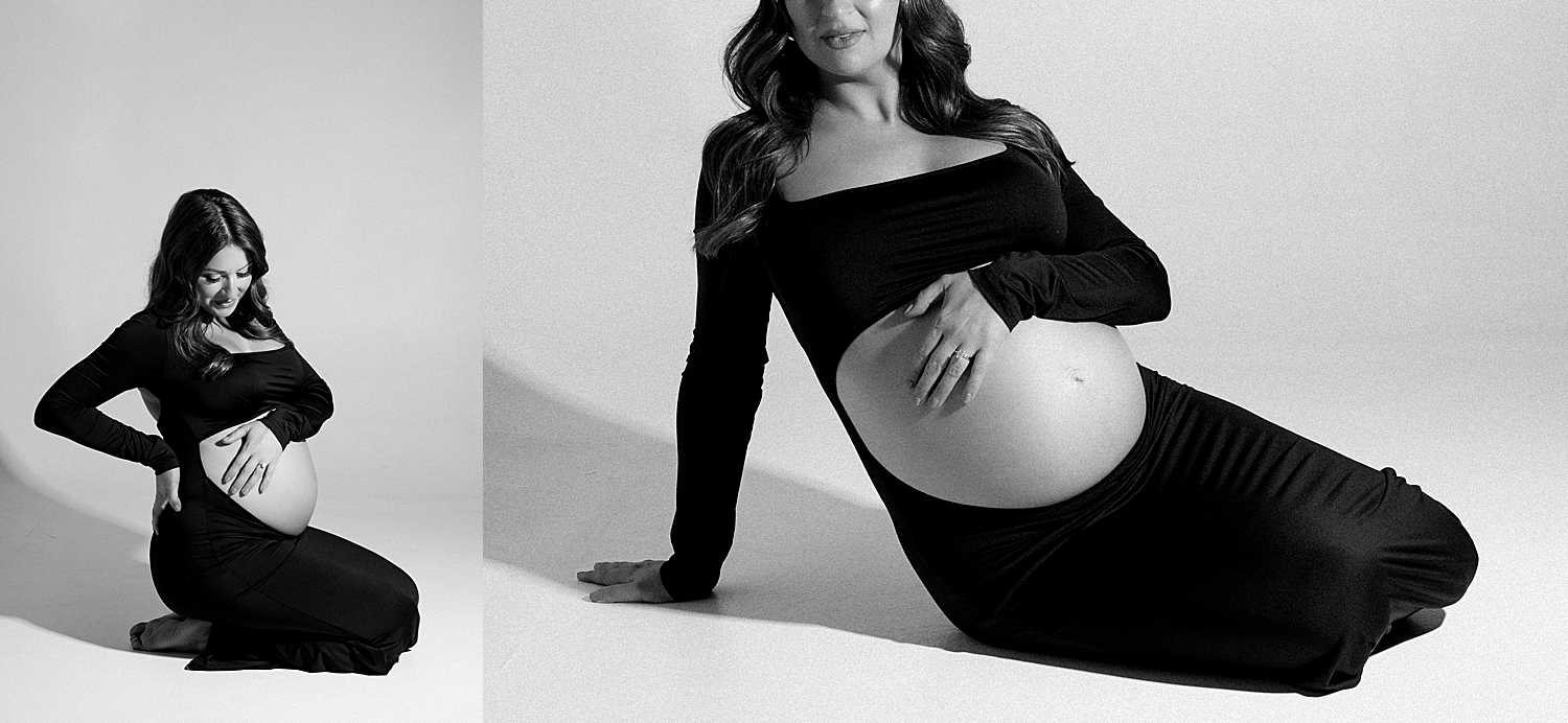 woman with bump in black dress on floor by Tampa boudoir photographer 