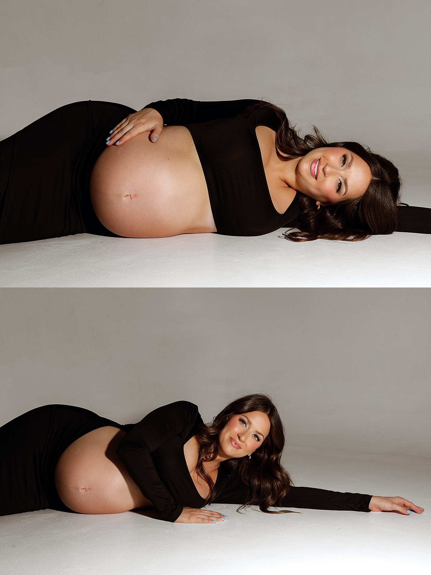 mom lies on the floor holding bump in studio glamour lighting