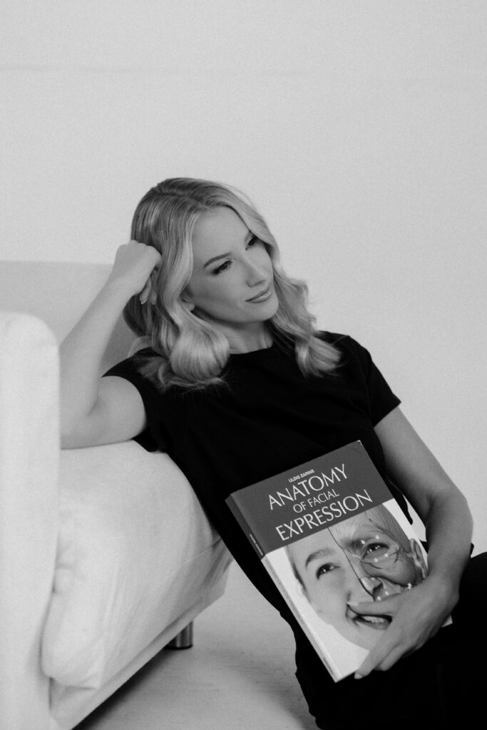 Annie Smalley, FNP-C wearing navy scrubs during her Tampa branding session for aesthetic injectors.