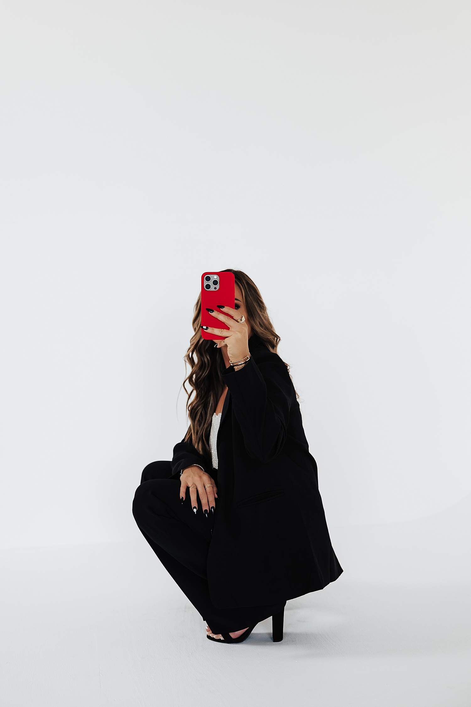 marketing manager holds up red phone for photo for Best Branding Session